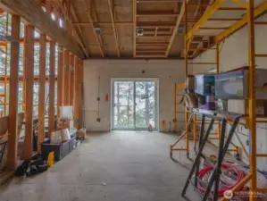 Master Bedroom with great room to the left. The home is planned with it's own outside deck overlooking the Hood Canal.