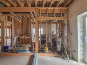 First bedroom with exit to the right. Second bedroom is behind framed in wall.