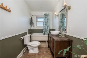Clawfoot tub and thoughtful finishes in Bathroom #1