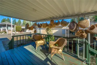 Relax year-round on the covered front deck, an ideal spot for fresh air and quiet evenings.