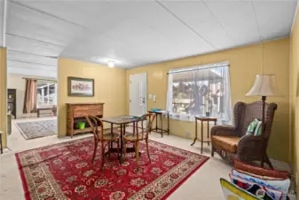 Spacious living room filled with natural light and room to comfortably entertain or relax.