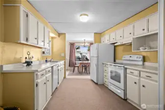 Bright kitchen with generous cabinetry and prep space, ready for home-cooked meals and holiday baking.