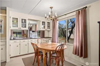 Light-filled dining area with built-in cabinetry, perfect for hosting friends or holiday gatherings.
