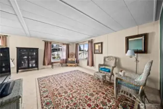 Spacious den just off the dining area, ideal for a cozy TV room, reading retreat, or hobby space.