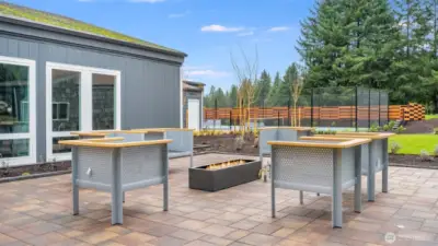 Inviting outdoor patio featuring a gas firepit and seating area—perfect for evening gatherings and relaxed conversation.
