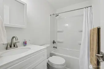 Bathroom - New shower tub combo with new vanity and quartz counter top