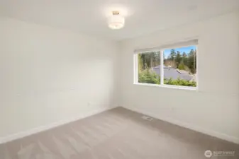 There are two secondary bedrooms on the upper floor. New carpets throughout all the bedrooms