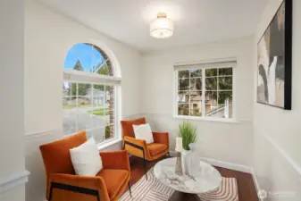 Cute versatile space in the primary suite - use as a sitting area, a work out space, or even a nursery.   The arched window is a stunning detail