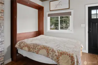 In the main entry is a custom hide a way bed, perfect for extra guest.