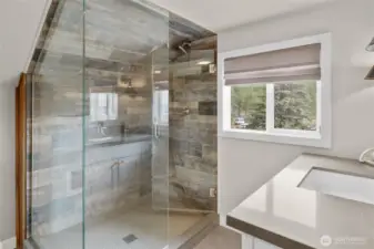 Large oversized shower in the upper primary restroom creates such a lavish bathroom.