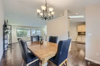 LARGE DINING AREA W/ ATTRACTIVE CHAIR RAIL, CAN EFFORTLESSLY SEAT EIGHT OR MORE.