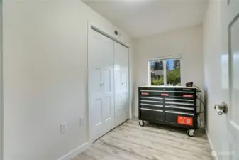Den, office or craft room off this flex/mud room. The water heater and furnace are behind the double doors you see. What would you use this space for?