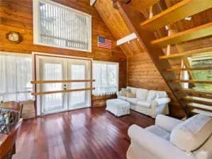 Living room with lots of windows embracing the light!