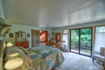 Primary Bedroom private balcony and peek-a-boo doors above wet bar