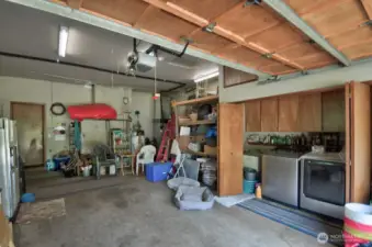 Garage interior with water heater and laundry hook ups. (W/D do not convey)