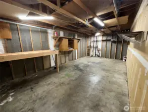 One car garage with laundry area.