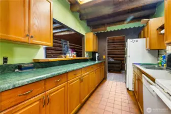 Every corner of the entry showcases craftsmanship, from the squared front door to the chinked log beams overhead. This space makes a strong first impression, setting the tone for the rest of the cabin.