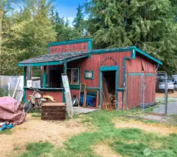 A creative saloon-style outbuilding labeled “Mercantile” and “Telegraph,” adding Old West charm to the property. Perfect as a workshop, storage, or just a fun feature that highlights the unique character of this home.