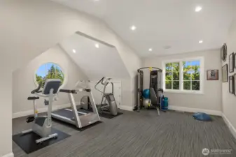A home gym and spa bath complete the additional home amenities.