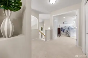 Upper loft area with french doors into brimary bedroom