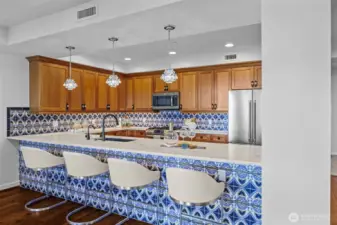 Entertain in style with this beautifully designed open kitchen, complete with custom finishes and designer details.