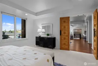 Wake up to a seamless flow from your private retreat to the heart of the home.