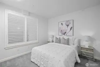 Bedroom #2 features charming custom shutters that add style and privacy.