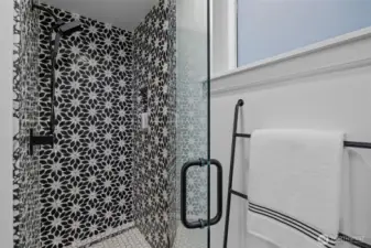 Stunning guest bathroom featuring a sleek walk-in shower and modern finishes