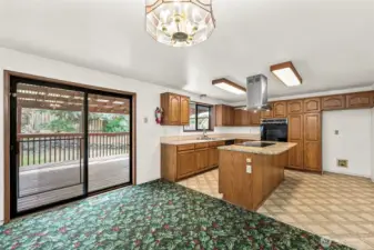 Dinning area with slider to covered back deck.