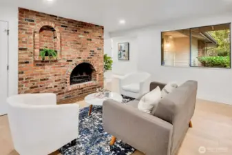 Cozy Brick Fireplace Lounge, Curl up beside the character-filled brick hearth, where timeless craftsmanship meets modern comfort.