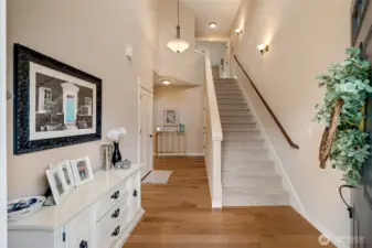 Immediately greeted w/soaring ceilings & wide hallways...