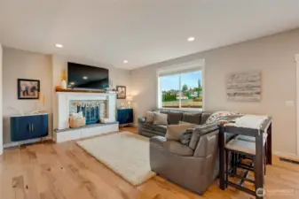 Seamlessly flowing to open great room w/gas fireplace...