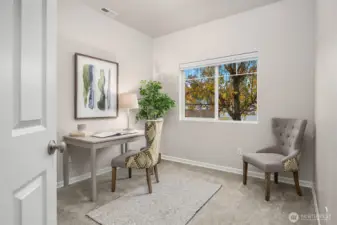 Main floor bedroom or ideal office space!