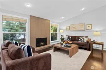 Beautiful living room with lots of light, cozy fireplace