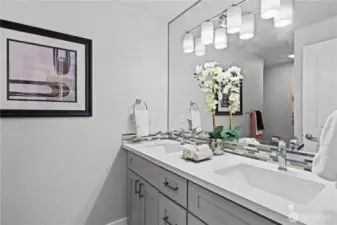 Bedrooms 2 & 3 share this full bath with double vanity