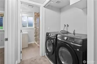 Laundry in the hall between bedroom & bath