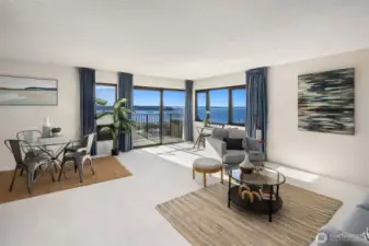 Perched on the fifth floor, this sunny, light-filled corner condo frames sweeping west-facing views of Elliott Bay, the Space Needle, downtown, and the Olympic Mountains.