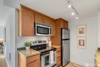 Kitchen has plenty of counter and cabinet space.