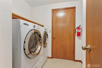 Laundry room with a door to the garage