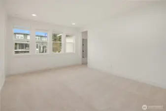 Sitting area with one bedroom to the left and two bedrooms on the right