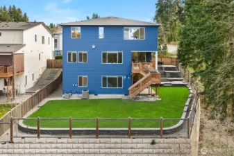 Exterior back: Spacious backyard, balcony and terrace patio to the right