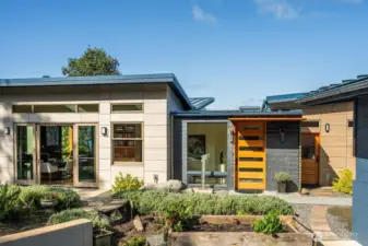 Sustainability drove many of the design choices of this recent build: fire retardant Swisspearl fiber cement and Vermont slate siding, a metal roof, and a 39 panel solar array.