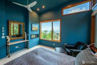 The primary suite has high ceilings, spectacular views, reading lights, and a gas fireplace.