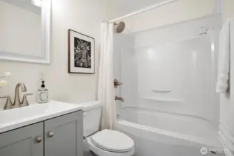 The 2nd bathroom with a shower/tub combo.