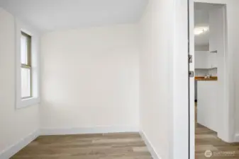 A spacious mudroom at the back of the house, you can enter into this area from the back door. Perfect place for shoes, coats, bikes, storage etc.