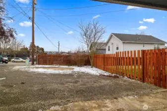 Ample extra parking behind the carport.