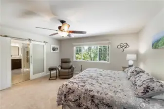 Retreat mode: activated. Spacious, serene, and filled with natural light—plus sliding barn doors that open to a spa-worthy ensuite.