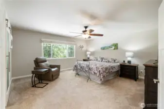 Primary Bedroom (alternate angle) – Spacious layout with neutral tones and large window view.