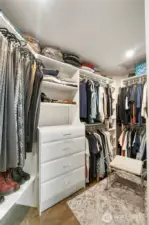 Primary Walk-in Closet – Well-organized custom built-ins with ample storage, drawers, and hanging space.