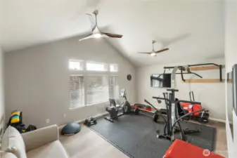 Your flex space, flexing. Bonus room with vaulted ceilings currently serving up fitness realness—but could moonlight as a playroom, studio, or theater.